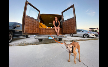 jen and tigger enjoying the sunset from the rear door of the van